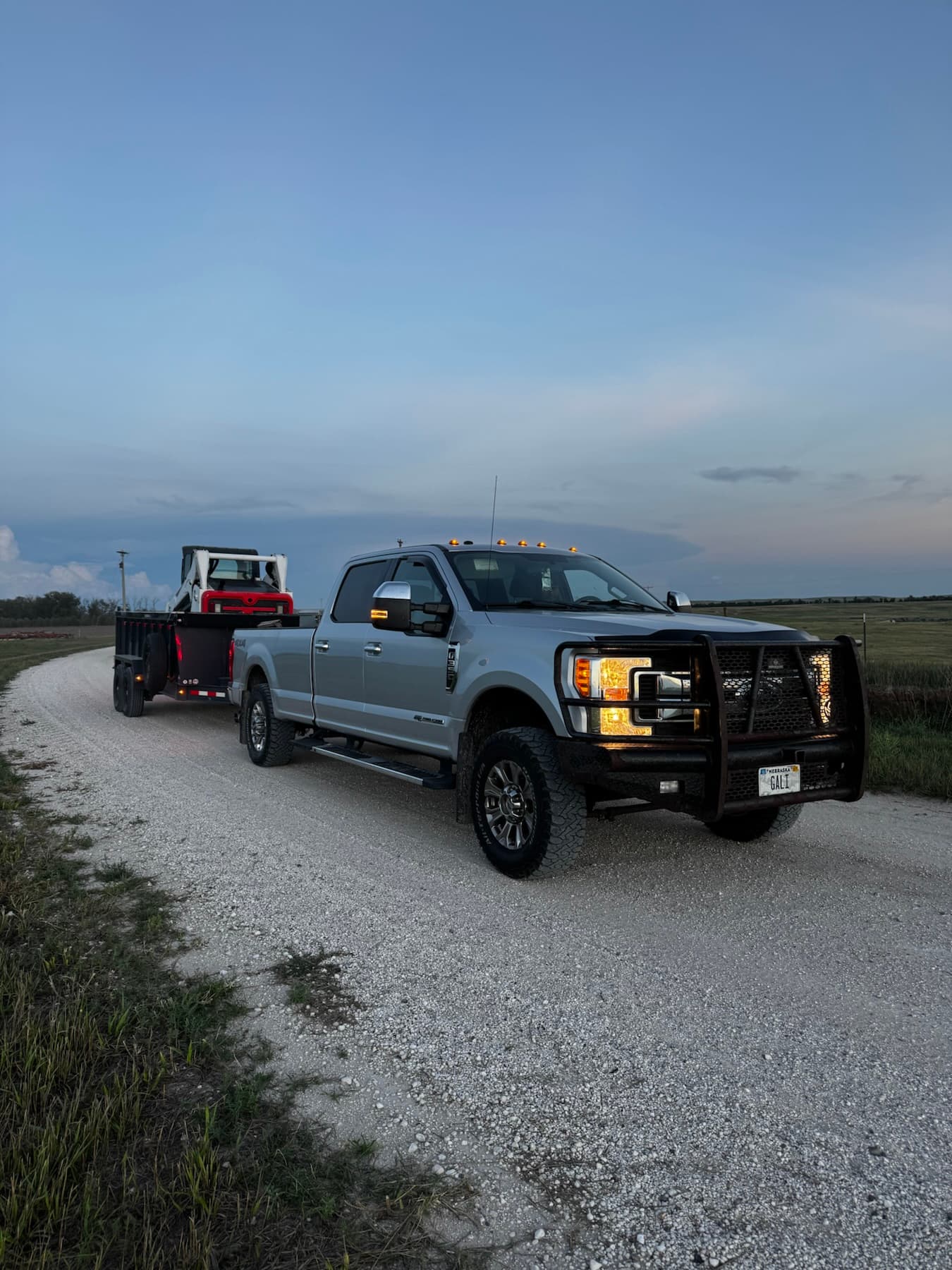 Gali Masonry work truck and equipment trailer at sunset in the Nebraska Panhandle